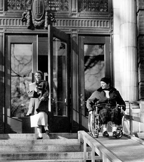woman using wheelchair ramp at Lincoln Hall in 1950s